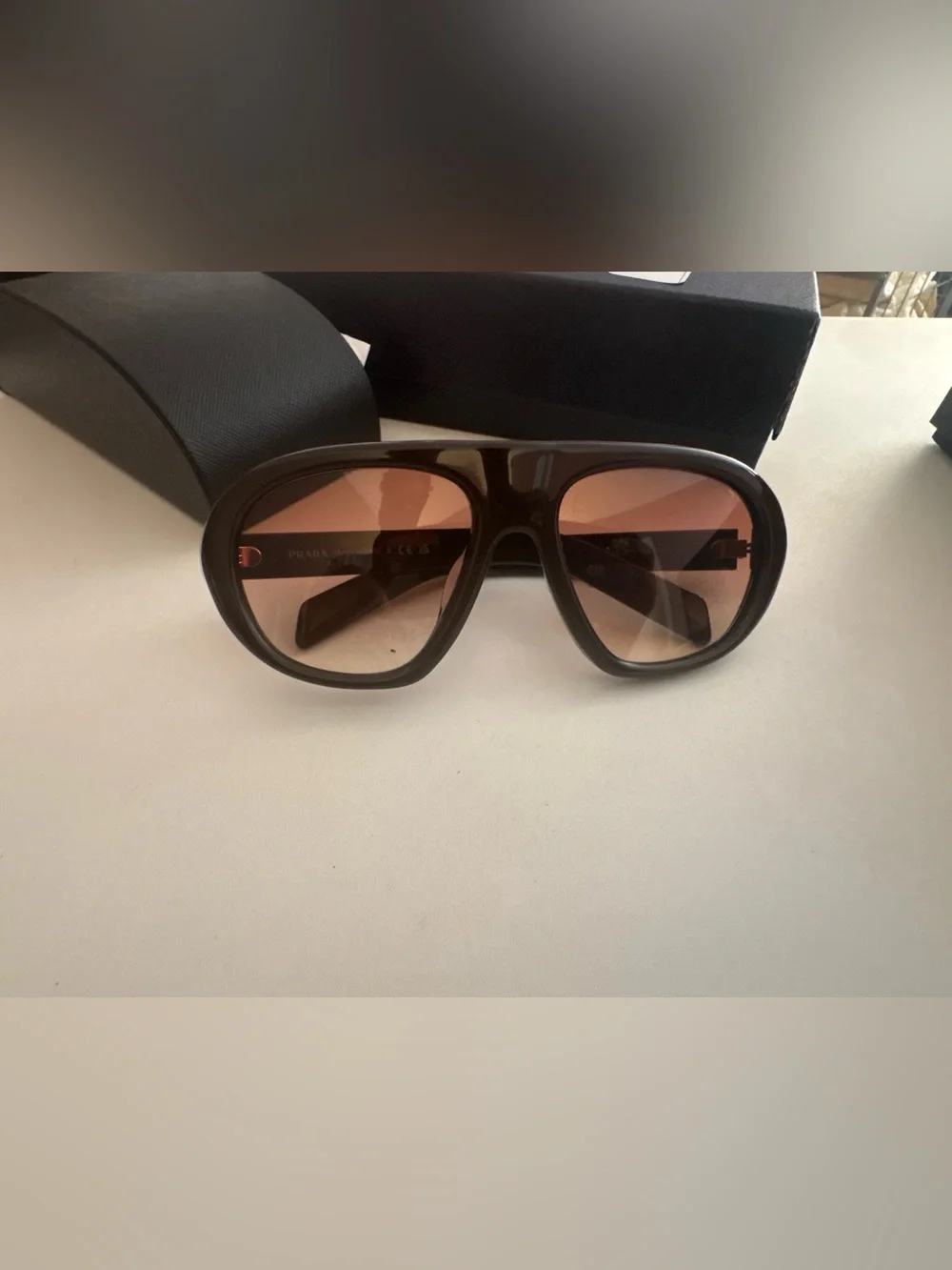 Prada Men’s Black Frame Sunglasses with Brown Gradient Lenses